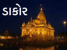 Night view of Shree Ranchhodraiji Temple in Dakor Gujarat illuminated with golden lights with devotees near the holy lake.