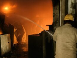 Firefighter dousing flames during the fire accident at Sanket India warehouse in Anand, Gujarat.